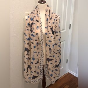 Printed Village ocean themed 37” x 70” oblong scarf. Pinkish, blue & black.